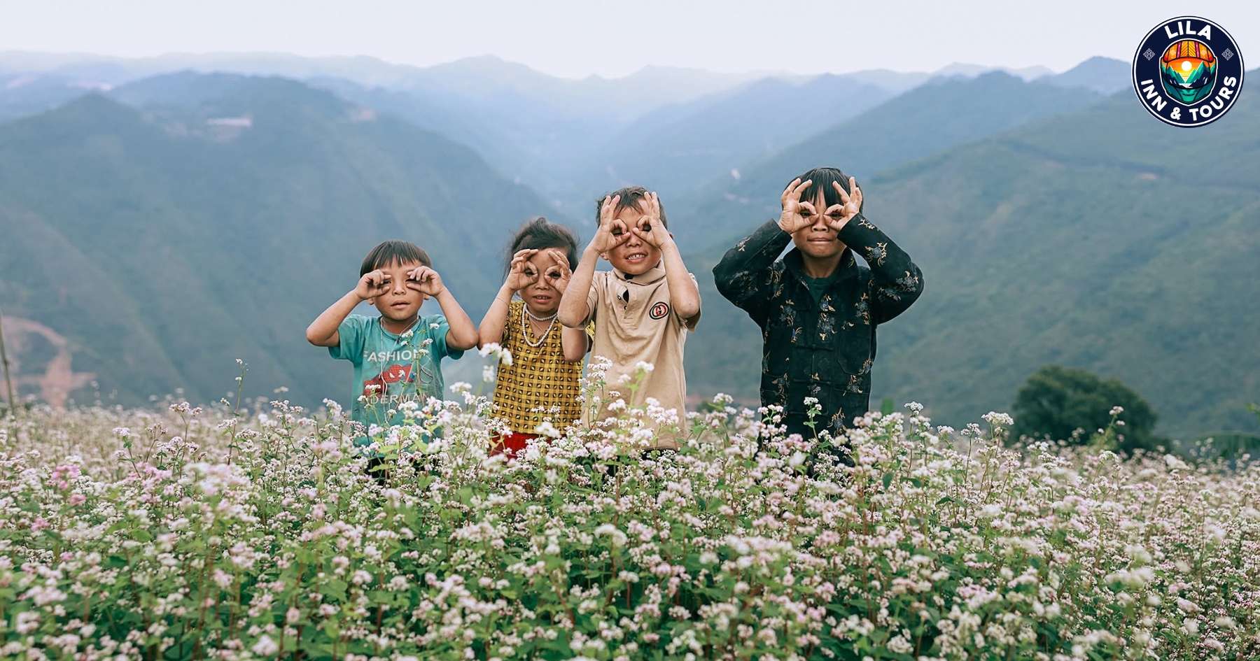 Four children posing for photos at the buckwheat flower field